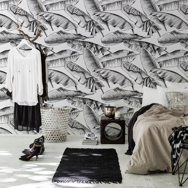 Papier peint Feuilles noires dans le vent