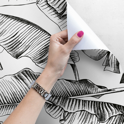 Papier peint Feuilles noires dans le vent