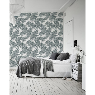 Papier peint Un souffle de vent dans les feuilles de palmier