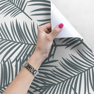 Papier peint Un souffle de vent dans les feuilles de palmier