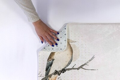 Tapis de bain Un oiseau sur une branche