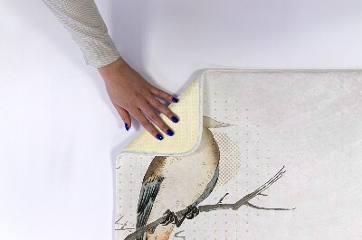 Tapis de bain Un oiseau sur une branche