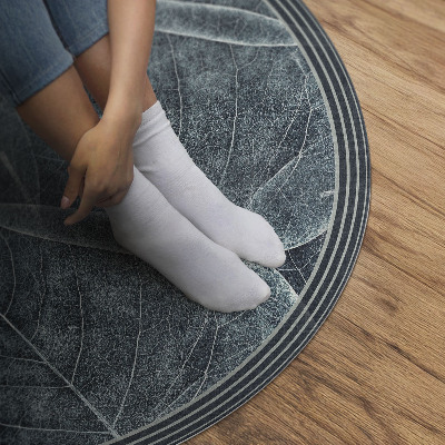 Tapis rond en vinyle Feuilles de plantes sombres