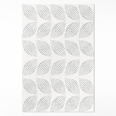 Tapis vinyle Une composition de feuilles sombres avec des points