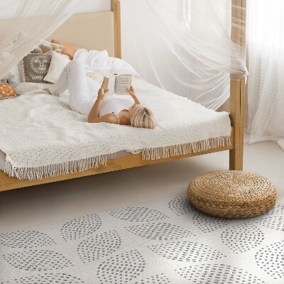 Tapis vinyle Une composition de feuilles sombres avec des points