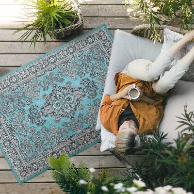 Tapis vinyle d’extérieur Motif décoratif bleu avec un motif végétal