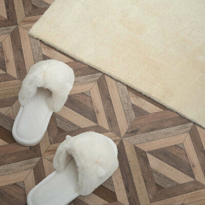 Carreaux de vinyle auto-adhésifs Un motif de planches naturelles dans des tons de marron