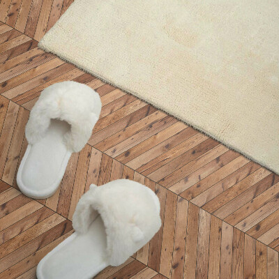 Carreaux pvc Un motif de planches disposées en diagonale de manière artistique