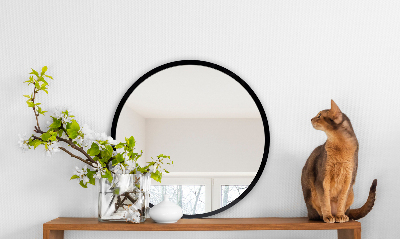 Miroir rond avec un cadre noir
