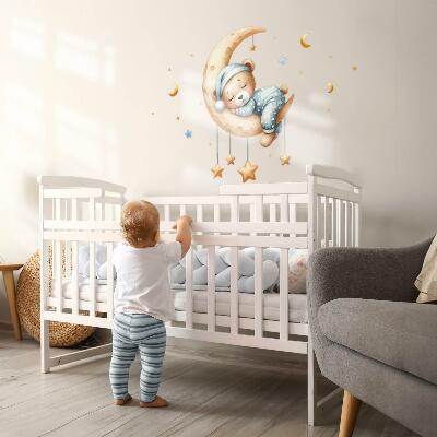 Autocollant mural 80x105 Ours en peluche endormi sur la lune dans un espace pastel