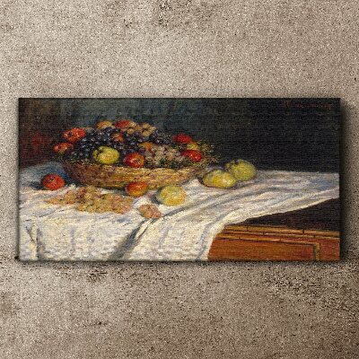 Tableau toile imprimée Corbeille de fruits sur une nappe blanche