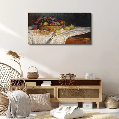 Tableau toile imprimée Corbeille de fruits sur une nappe blanche
