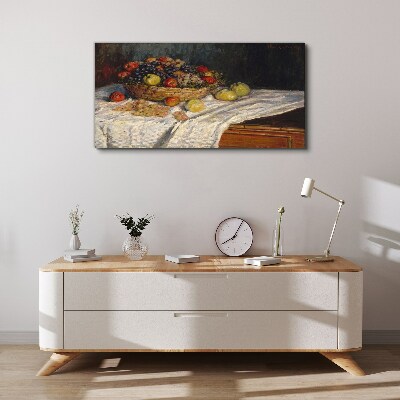Tableau toile imprimée Corbeille de fruits sur une nappe blanche