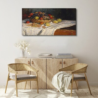 Tableau toile imprimée Corbeille de fruits sur une nappe blanche