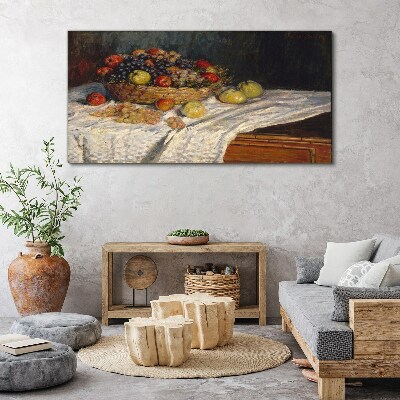 Tableau toile imprimée Corbeille de fruits sur une nappe blanche