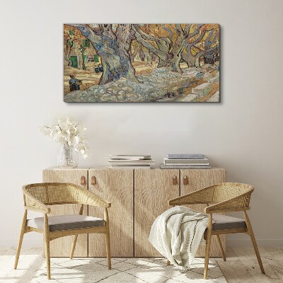 Tableau toile imprimée Une rue bordée d'arbres sous le soleil printanier