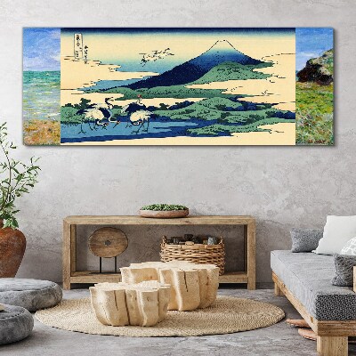 Tableau imprimé sur toile Grues près d'une montagne