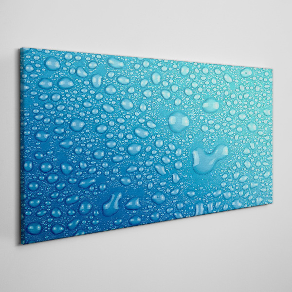 Tableau sur toile Gouttes d'eau sur fond bleu