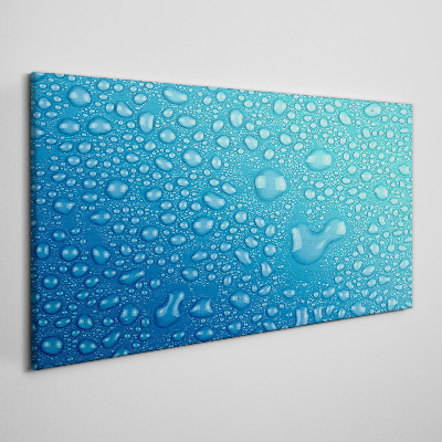 Tableau sur toile Gouttes d'eau sur fond bleu