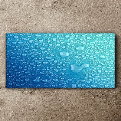 Tableau sur toile Gouttes d'eau sur fond bleu