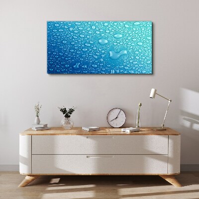 Tableau sur toile Gouttes d'eau sur fond bleu