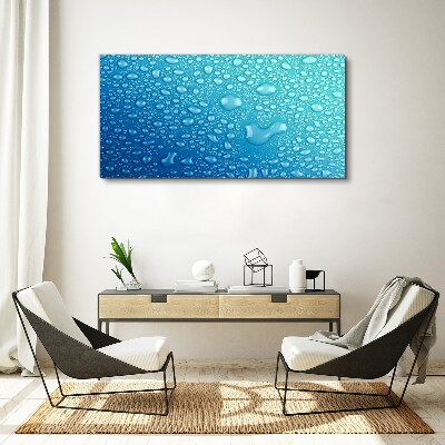 Tableau sur toile Gouttes d'eau sur fond bleu