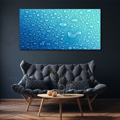 Tableau sur toile Gouttes d'eau sur fond bleu