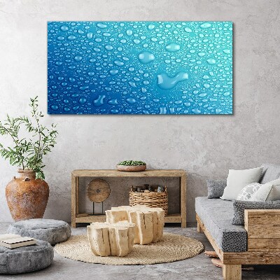 Tableau sur toile Gouttes d'eau sur fond bleu