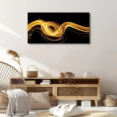 Tableau imprimé sur toile Des traînées de lumière dorées sur du noir