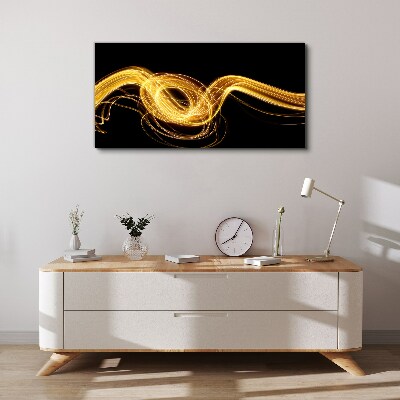 Tableau imprimé sur toile Des traînées de lumière dorées sur du noir
