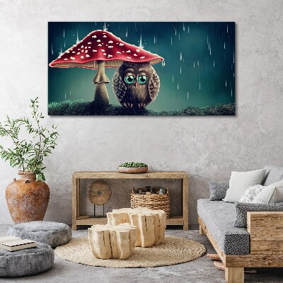 Tableau sur toile Un hibou sous un champignon sous la pluie