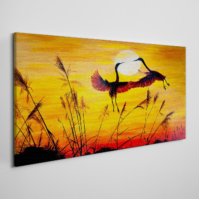 Tableau sur toile Grues dansantes au coucher du soleil