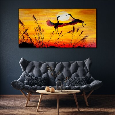 Tableau sur toile Grues dansantes au coucher du soleil