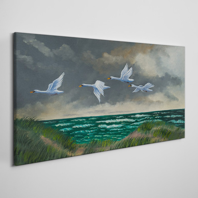 Tableau imprimé sur toile Vol de cygnes au dessus de la mer
