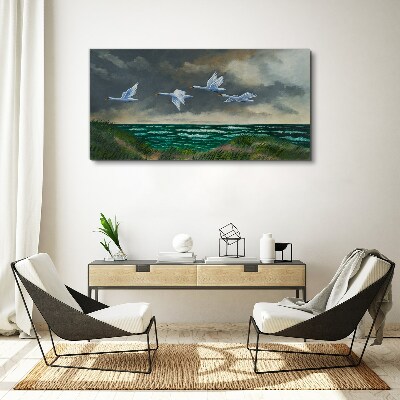 Tableau imprimé sur toile Vol de cygnes au dessus de la mer
