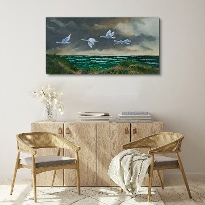 Tableau imprimé sur toile Vol de cygnes au dessus de la mer