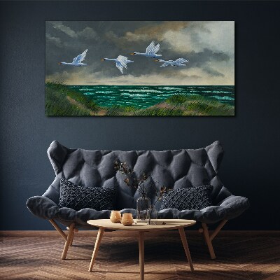 Tableau imprimé sur toile Vol de cygnes au dessus de la mer