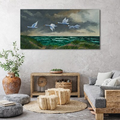 Tableau imprimé sur toile Vol de cygnes au dessus de la mer