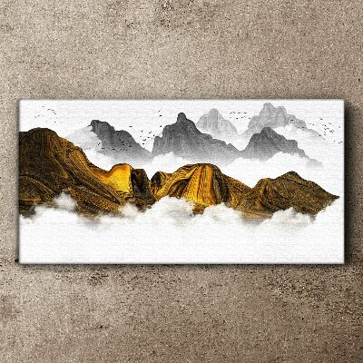 Tableau imprimé sur toile Des montagnes dorées dans les nuages