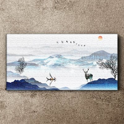 Tableau imprimé sur toile Un paysage de montagne paisible avec un cerf