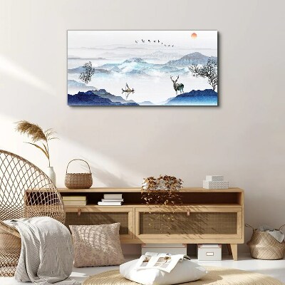 Tableau imprimé sur toile Un paysage de montagne paisible avec un cerf