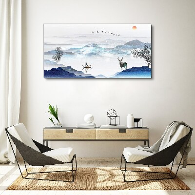 Tableau imprimé sur toile Un paysage de montagne paisible avec un cerf