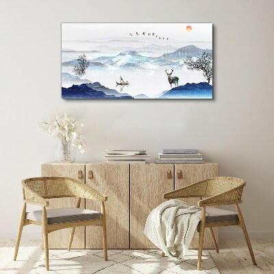 Tableau imprimé sur toile Un paysage de montagne paisible avec un cerf