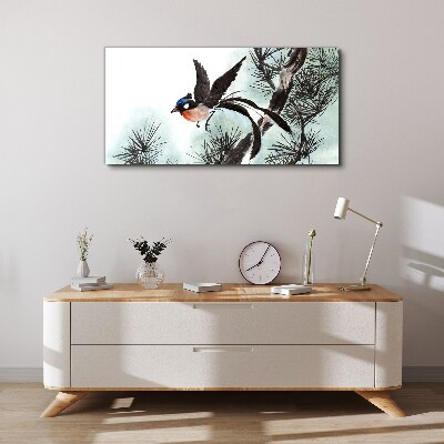 Tableau sur toile Un oiseau en vol au-dessus des pins