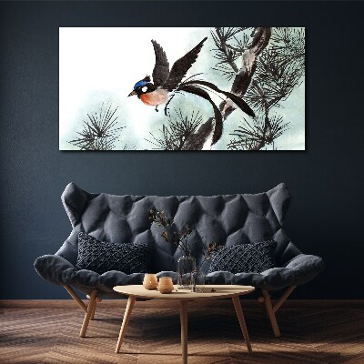 Tableau sur toile Un oiseau en vol au-dessus des pins