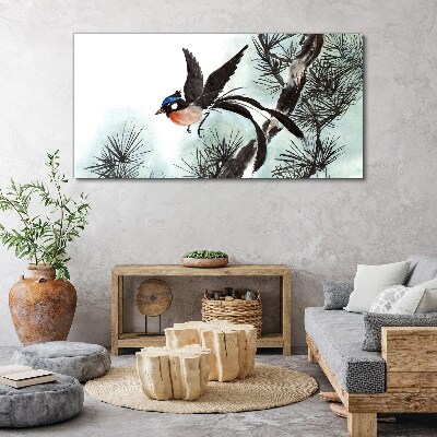 Tableau sur toile Un oiseau en vol au-dessus des pins