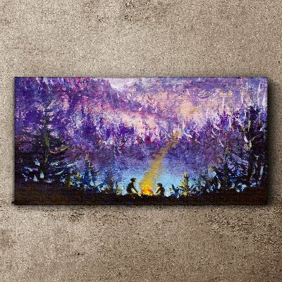 Tableau sur toile La magie d'un feu de camp en soirée dans la forêt