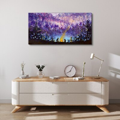 Tableau sur toile La magie d'un feu de camp en soirée dans la forêt