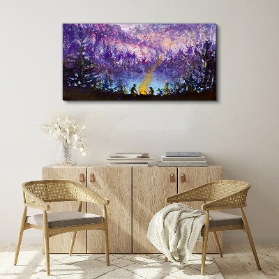 Tableau sur toile La magie d'un feu de camp en soirée dans la forêt