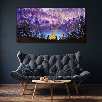 Tableau sur toile La magie d'un feu de camp en soirée dans la forêt